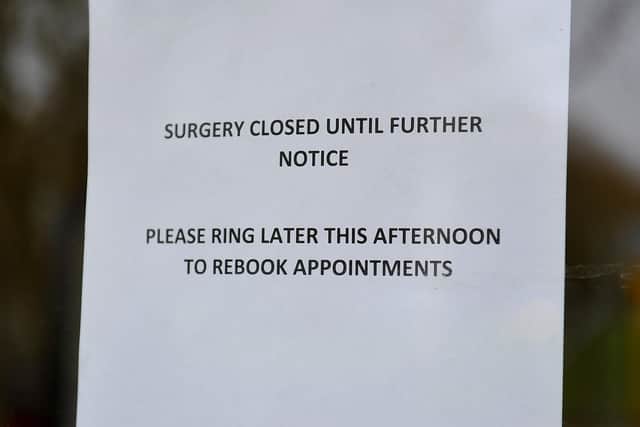 A sign on the Burgess Hill surgery's doors. Picture: Steve Robards