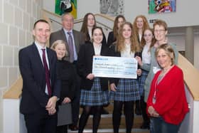 A cheque of £10,000, raised through community and fundraising events, is set to be put to good use by Midhurst Rother College.Picture shows Principal Stuart Edwards, college business manager Kath Chard, chair of governers David Lawes, members of the MRC netball neam and Anita Haigh and Hilary O’Sullivan from MRC Parents SUS-201103-131146001