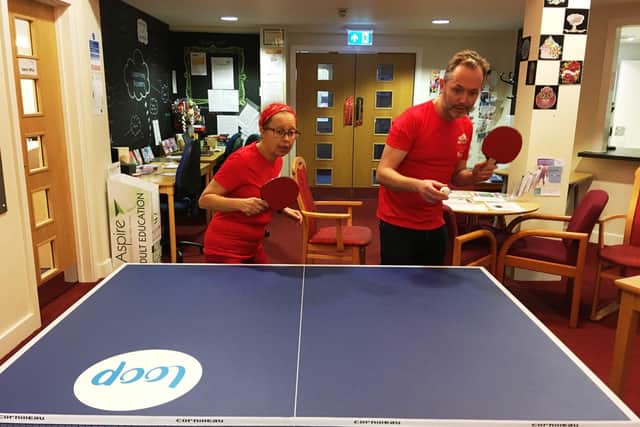 Sarah Palmer and Rupert Murrell from West Sussex Mind playing table tennis, just one of many activities available at drop-in sessions