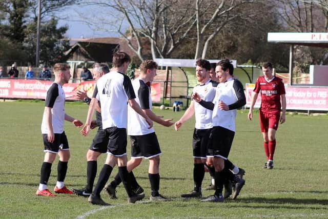 Pagham celebrate a goal v Little Common / Picture: Roger Smith