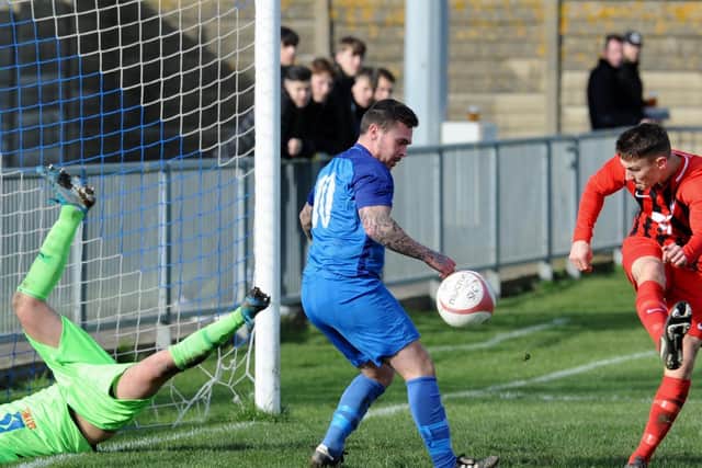 Action from Saturday's game between Shoreham and Worthing United. Picture by Stephen Goodger