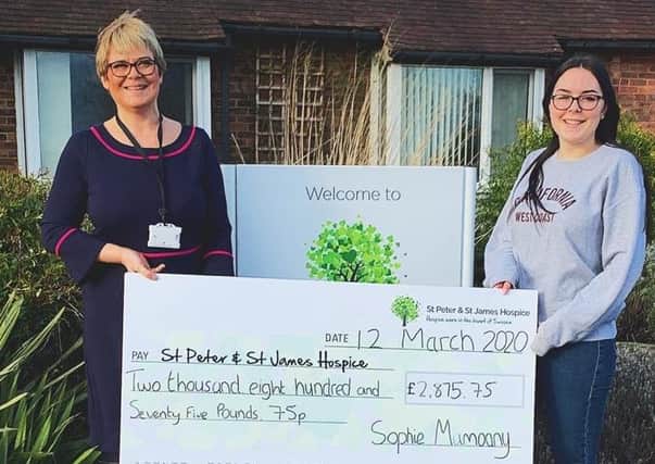 Sophie Mamoany presenting a cheque to St Peter and St James Hospice