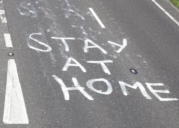 Sign painted on the road. Picture: Eddie Mitchell