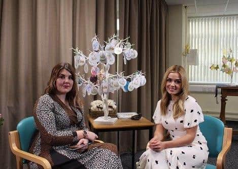 Kylea Reynolds and Katherine Jenkins with the remembrance tree which includes baby Logan