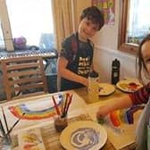 Harvey, 9, took a morning maths class, and spent the afternoon painting rainbows with 6 year old Gracey- photo courtsey of Lucy Elder 9_dwBJmAC-PeQZnLDAf0