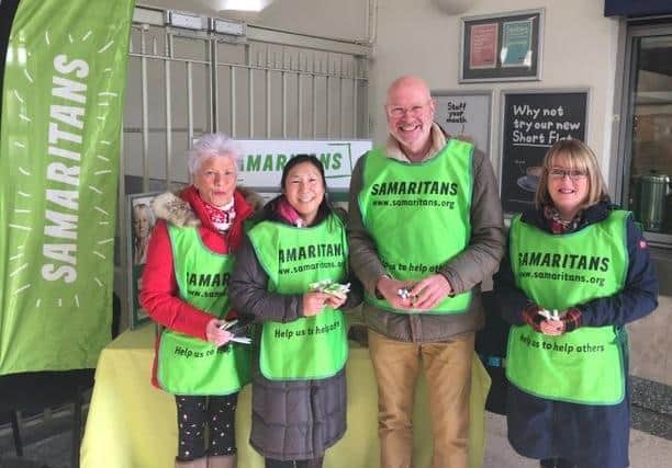 A reminder of work Worthing Samaritans volunteers have done in the past, here handing out free tea at Worthing railway station for Brew Monday