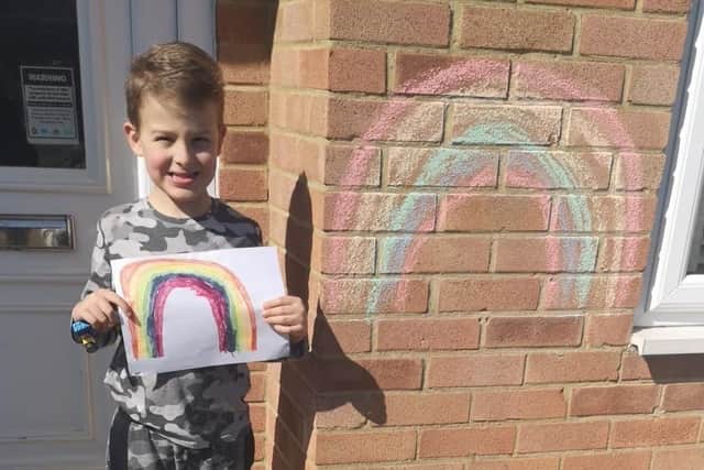 Lewis, aged 6, with his rainbow