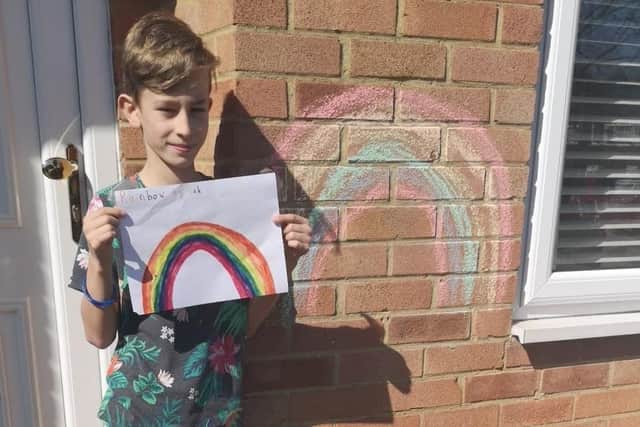 Seb, aged 11, with his rainbow