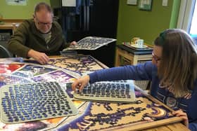 Adrian Munn and his daughter Louise working on the family jigsaw puzzle