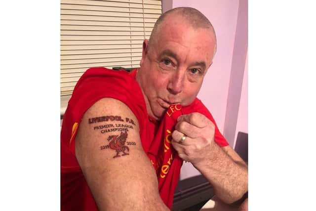 Mark Gretton, 53, has tempted fate with his Liverpool Premier League champions tattoo SUS-200402-094416001