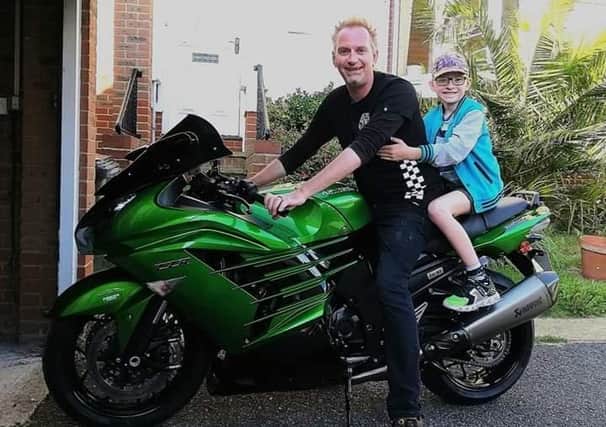 Keith with his son Krystian on his motorbike, which has been stolen