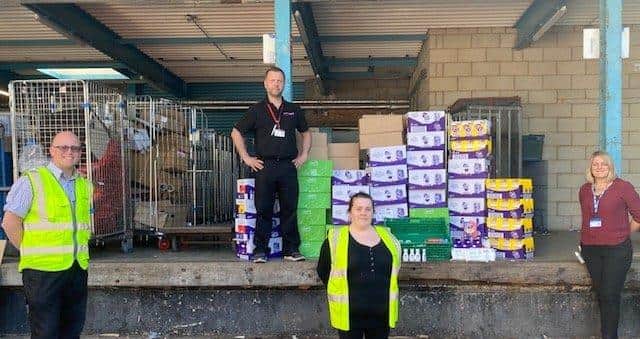 Kara and James (centre), who work for Waitrose, Jacquie (right) is dealing with the NHS donations and (left) a hospital worker
