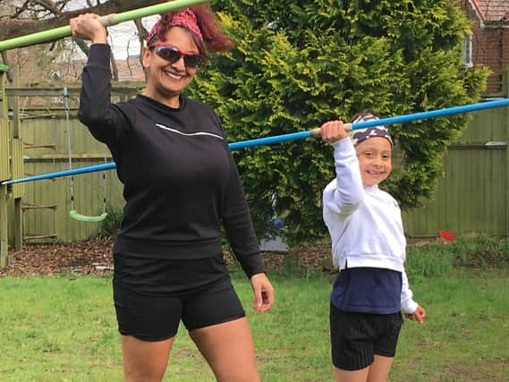 Aneela Rose and her daughter practicing the javelin SUS-200704-155220001