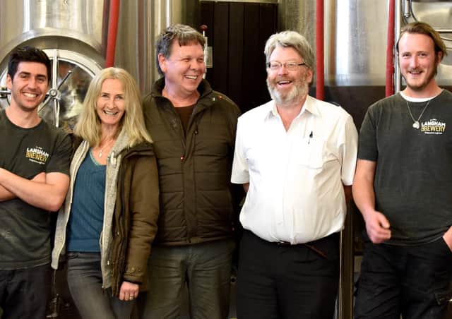 Saulo Parreira, head brewer, Lesley Foulkes, James Berrow, Martyn Constable and Rich Snabel with Alfie the dog