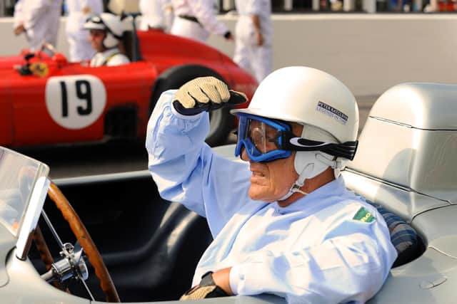 Where he belonged ... Sir Stirling Moss in the cockpit / Picture: Malcolm Wells