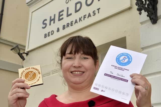 Judith Brown with her 'Plastic Free Champion' certificate outside her Sheldon B & B in Burlington Place, Eastbourne (Photo by Jon Rigby) SUS-190910-150004008