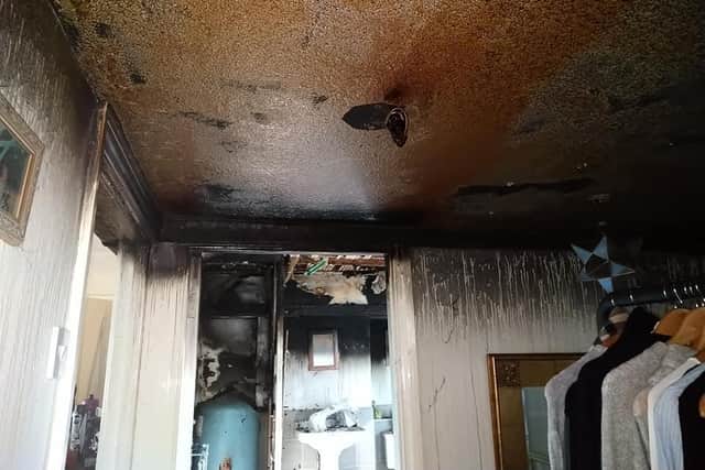 The now melted smoke alarm which 'alerted the occupiers to the fire'.Photo: Petworth Fire Station