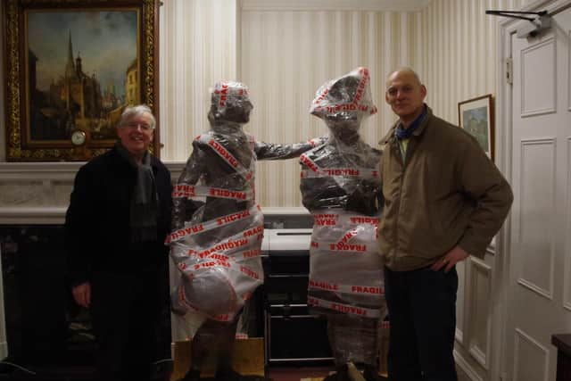 Richard Plowman and Vincent Gray with the resin sculptures of Murray and Nelson