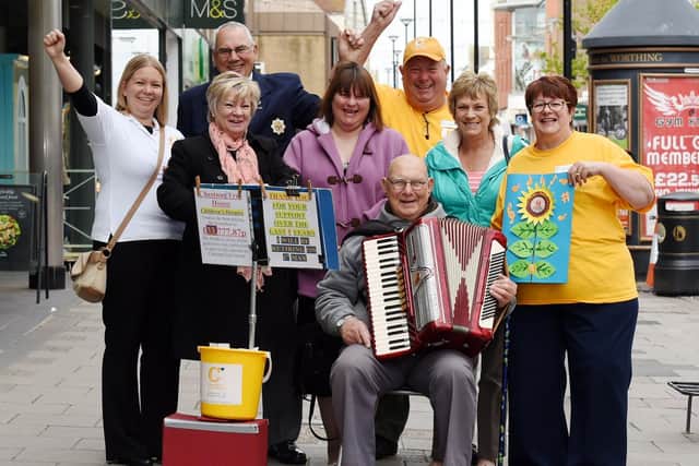 George Smewing, pictured outside M&S in Montague Street in Worthing when he retired from busking for the first time in 2015, has passed away aged 90