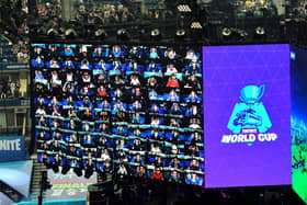 Players are seen on screen during the final of the Solo competition at the 2019 Fortnite World Cup July 28, 2019 inside of Arthur Ashe Stadium, in New York City. (Photo by Johannes EISELE / AFP)        (Photo credit should read JOHANNES EISELE/AFP via Getty Images) 775341798