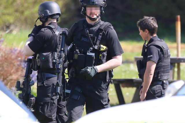 Armed police at the scene this morning
