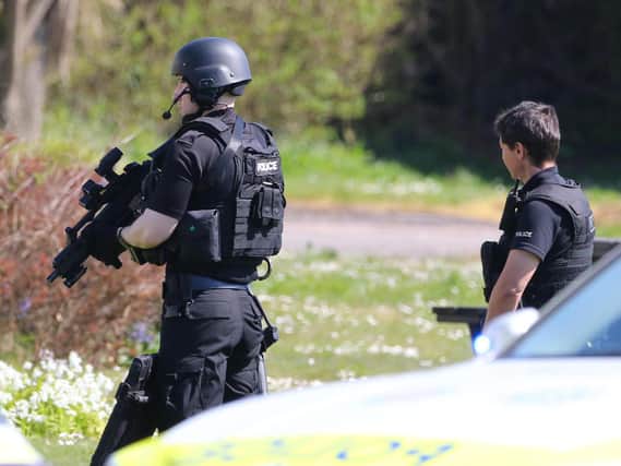 Armed police responding to the incident this morning