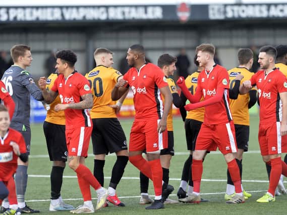 Elbow bumps replaced handshakes at Eastbourne Borough's final game / Picture: Jon Rigby