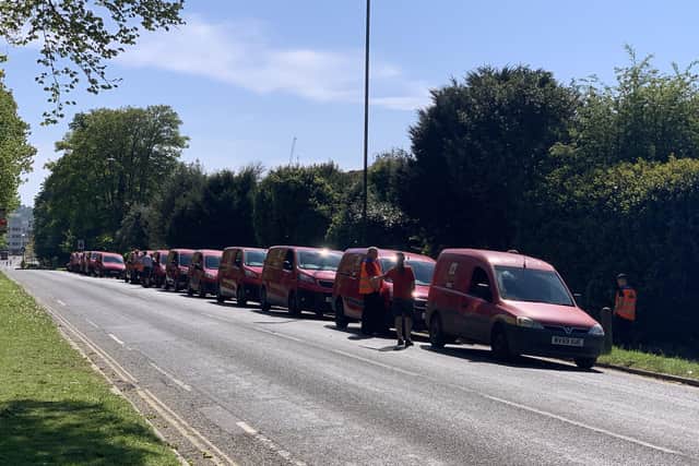Postmen lined up in their vans in a tribute to their colleague John Brooksbank SUS-200422-115556001