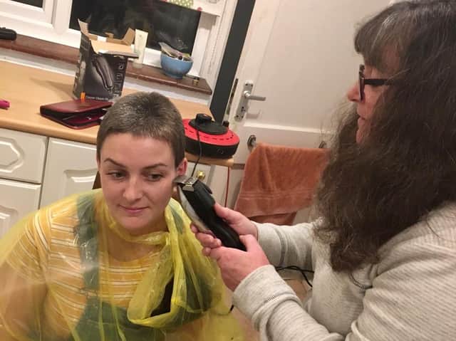 Local democracy reporter Fiona Callingham having her head shaved by mum Tracey who works at St Wilfrid's Hospice. Picture: Fiona Callingham
