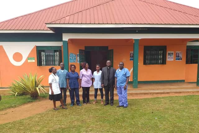 Fr Silvester Kewaza Bukenya and staff outside the medical centre in Narozari