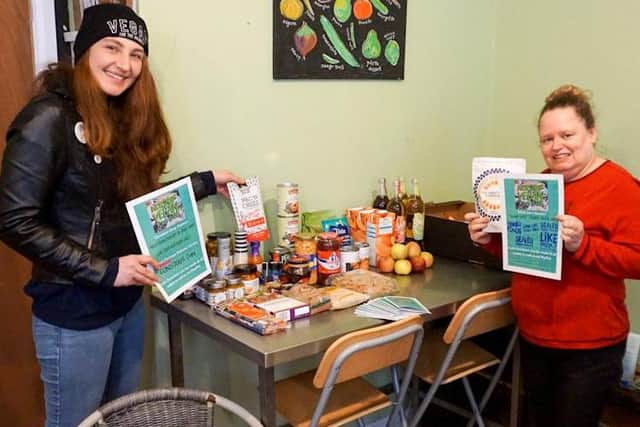 Worthing Vegan Food Bank Network founder Pia Offord, left, and Jeannette Compton with some of the food available