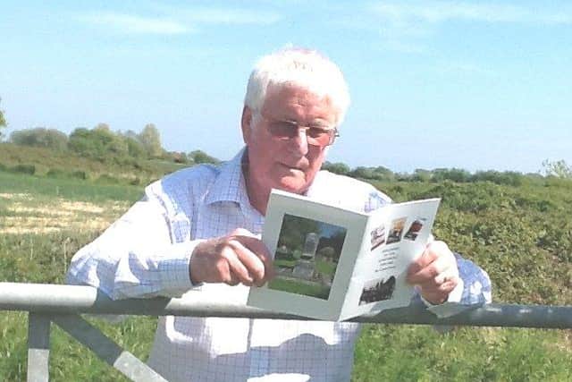 Sidlesham parish councillor Colin Field with his booklet