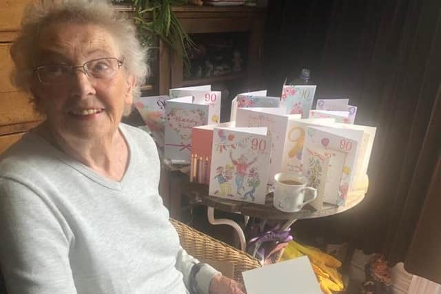 Anne Wilson opening all her cards on her 90th birthday
