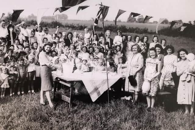 The VE Day party in Rose Green, with Molly Myers and her mum, far right