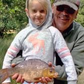 A young Petworth and Bognor angler with a crucian carp