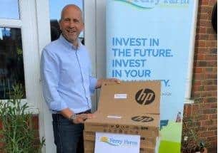 Ben Cooper, founding director at Ferry Farm Community Solar, ready to deliver laptops to schools