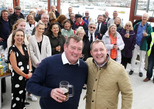 Members of the Sussex Yacht Club at a symbolic ceremony to mark the building of the new clubhouse last year