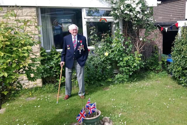 Joe Sealey wearing his medals for VE Day 75, which he celebrated with a beer in his front garden