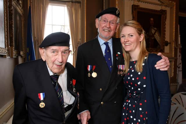 Joe Sealey, right, at the Legion D’Honneur ceremony in 2016, with his granddaughter Amy Huley and Eric Warburton, the man who saved his life. Photo by Derek Martin DM1613379a