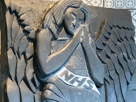 Angel carved out of slate