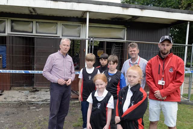 Staff and pupils at The Prebendal School, by the remains of the pavilion last year. Photo: Kate Shemilt. ks190288-3