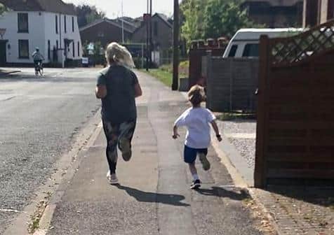 With his mum and dad alongside him, Kian ran two miles for seven days, raising more than £700.