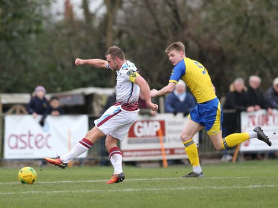 Sam Adams scores against Sittingbourne - and he will be back in the white shirt again for 2020-21 / Picture: Scott White