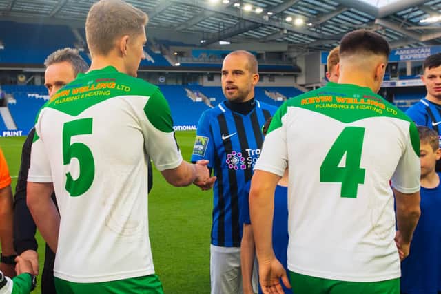 Chad Field shakes hands with Dan Beck before last year's Sussex Senior Cup final at the Amex - the last game he played / Picture: Tommy McMillan