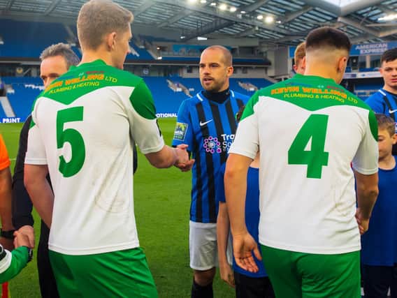 Chad Field shakes hands with Dan Beck before last year's Sussex Senior Cup final at the Amex - the last game he played / Picture: Tommy McMillan