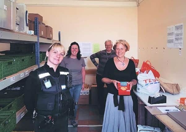 PS Amy Mcalees with foodbank staff