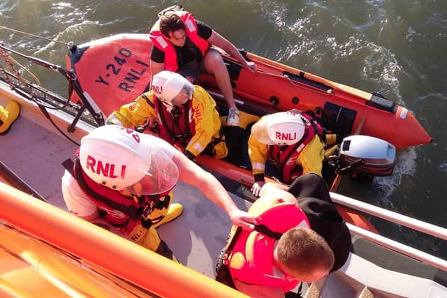 Eastbourne Lifeboat crews rescuing the stranded kayakers