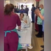 Orlando Fulgenicio being applauded by his colleagues as he leaves critical care at Eastbourne DGH SUS-200520-155709001