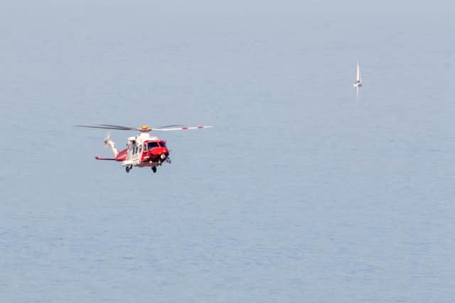 The HM Coastguard helicopter leaving the scene on Wednesday (May 20) - Photo by Pete Abel SUS-200521-121240001