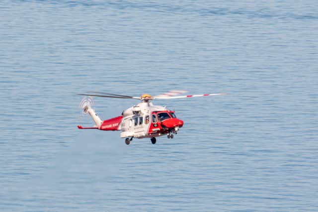 The HM Coastguard helicopter leaving the scene on Wednesday (May 20) - Photo by Pete Abel SUS-200521-121216001